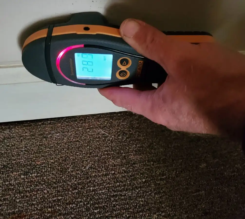 Moisture detection at baseboard during Burst Pipe Cleanup in Asbury Lake